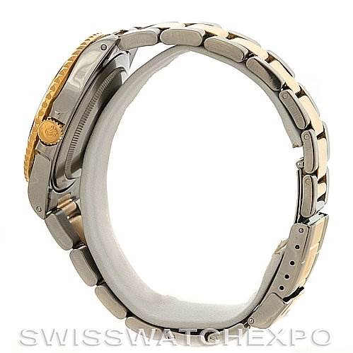 Side view of the Rolex GMT-Master 16713 Men's Stainless Steel Black Dial 16713 Men's Stainless Steel Black Dial watch, showing the bezel, crown, and part of the bracelet.