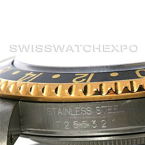 This image shows a close-up of the bezel, side case, and serial number of the Rolex GMT-Master 16713 Men's Stainless Steel Black Dial 16713 Men's Stainless Steel Black Dial.
