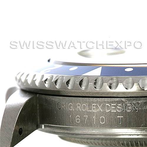 Close-up of the side of a Rolex GMT-Master 16710 Men's Stainless Steel Black Dial 16710 Men's Stainless Steel Black Dial watch, showing the bezel edge and engraved text "ORIG. ROLEX DESIGN 16710 T."