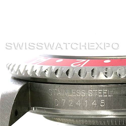 This close-up image of the Rolex GMT-Master 16710 Men's Stainless Steel Black Dial 16710 Men's Stainless Steel Black Dial watch shows part of the bezel and the engraved serial number on the side.