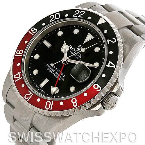 The image shows a Rolex GMT-Master 16710 Men
s Stainless Steel Black Dial 16710 Men
s Stainless Steel Black Dial watch displaying its face, bezel, crown, and part of its bracelet at an angled view.