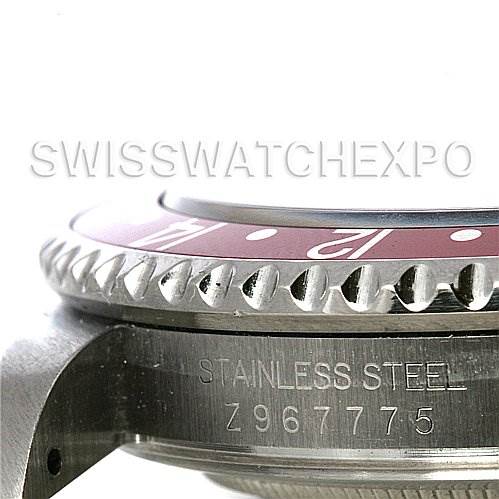 This image shows a close-up of the side of a Rolex GMT-Master 16710 Men
s Stainless Steel Black Dial 16710 Men
s Stainless Steel Black Dial watch, including the bezel, case, and serial number.