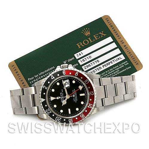 The image shows a Rolex GMT-Master 16710 Men
s Stainless Steel Black Dial 16710 Men
s Stainless Steel Black Dial watch laid flat with a visible bezel, dial, bracelet, and accompanying Rolex Best Quality
ity card.