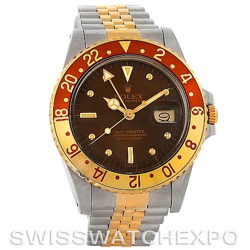 The image shows a front view of a Rolex GMT-Master 16753 Men
s Stainless Steel Brown Dial 16753 Men
s Stainless Steel Brown Dial watch, displaying the dial, bezel, crown, and part of the bracelet.