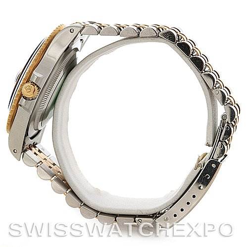 The image shows a side view of a Rolex GMT-Master 16753 Men
s Stainless Steel Brown Dial 16753 Men
s Stainless Steel Brown Dial watch, highlighting the case, bezel, crown, and bracelet.