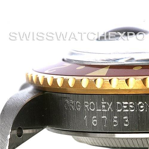 The image shows a close-up side angle of the Rolex GMT-Master 16753 Men
s Stainless Steel Brown Dial 16753 Men
s Stainless Steel Brown Dial watch, focusing on the bezel, crown, and model number engraving.