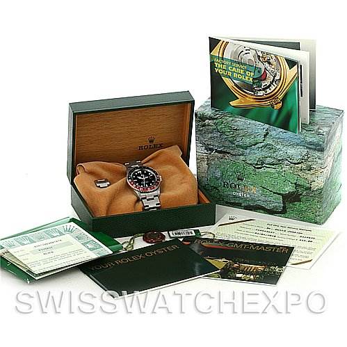 The image shows a Rolex GMT-Master 16710 Men's Stainless Steel Black Dial 16710 Men's Stainless Steel Black Dial watch in its open box, surrounded by booklets, warranty cards, and other accessories.