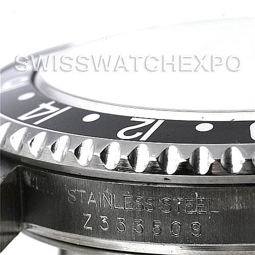 The image shows a close-up of the bezel, case, and serial number engraving of a Rolex GMT-Master 16710 T Men's Stainless Steel Black Dial 16710 T Men's Stainless Steel Black Dial watch.