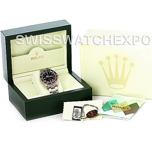 The image shows a Rolex GMT-Master 16710 Men's Stainless Steel Black Dial 16710 Men's Stainless Steel Black Dial watch in a display box with additional accessories, including tags and a manual, viewed from the front.
