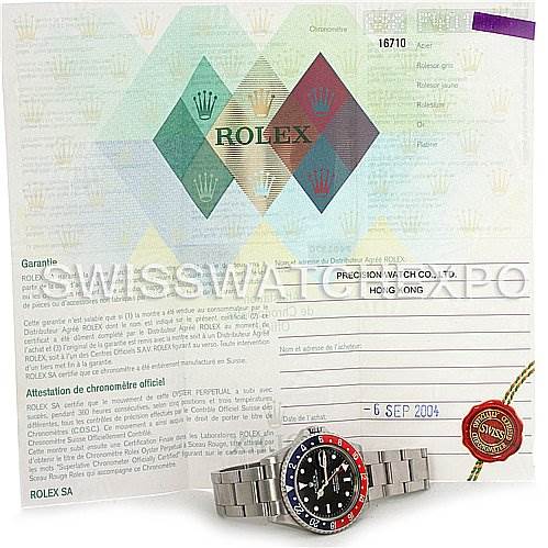 The image shows a Rolex GMT-Master 16710 Men's Stainless Steel Black Dial 16710 Men's Stainless Steel Black Dial watch with a certificate of authenticity and accessories, partially obscured.