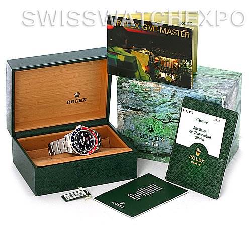 The image shows a Rolex GMT-Master 16710 Men's Stainless Steel Black Dial 16710 Men's Stainless Steel Black Dial watch in its box, accompanied by manuals, a warranty card, and an outer box.