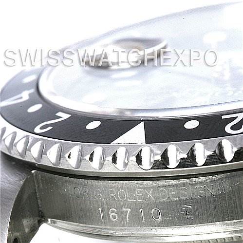The angle shows a close-up of the bezel, crystal, and part of the case with the model number on a Rolex GMT-Master 16710 Men's Stainless Steel Black Dial 16710 Men's Stainless Steel Black Dial watch.