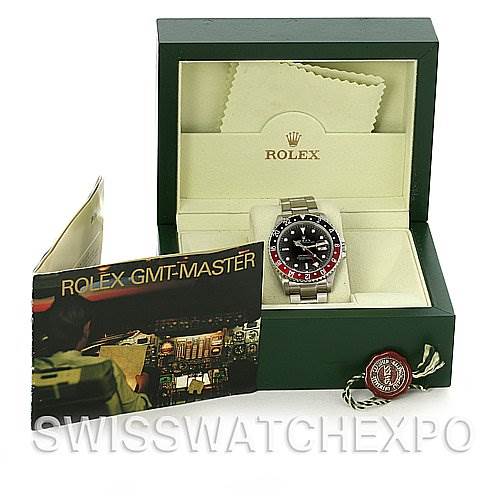 The Rolex GMT-Master 16710 Men's Stainless Steel Black Dial 16710 Men's Stainless Steel Black Dial watch is shown front-facing in its open box, along with its manual and accessories.