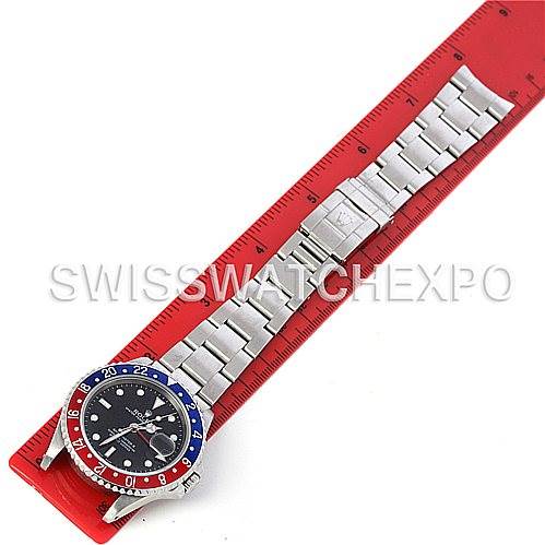 Top view of a Rolex GMT-Master 16710 Men's Stainless Steel Black Dial 16710 Men's Stainless Steel Black Dial watch, showing the full bracelet, bezel, and face, with a red ruler for scale.