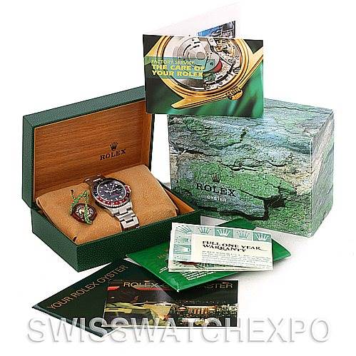 This image shows a Rolex GMT-Master 16710 Men's Stainless Steel Black Dial 16710 Men's Stainless Steel Black Dial watch at an angle inside its open box, accompanied by booklets, tags, and the outer packaging.