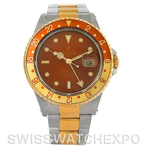 The image shows a front view of a Rolex GMT-Master 16713 Men
s Stainless Steel Brown Dial 16713 Men
s Stainless Steel Brown Dial with a brown dial, two-tone bezel, and a two-tone bracelet.