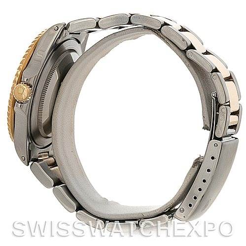 The image shows a side view of a Rolex GMT-Master 16713 Men
s Stainless Steel Brown Dial 16713 Men
s Stainless Steel Brown Dial watch focusing on its bracelet, crown, and case.