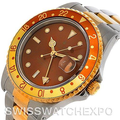 This image shows a close-up of the Rolex GMT-Master 16713 Men
s Stainless Steel Brown Dial 16713 Men
s Stainless Steel Brown Dial watch, focusing on the dial, bezel, and part of the bracelet.