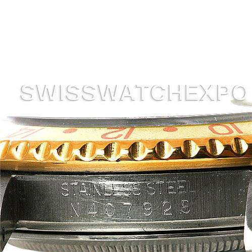 This image shows a close-up side view of the Rolex GMT-Master 16713 Men
s Stainless Steel Brown Dial 16713 Men
s Stainless Steel Brown Dial bezel and the serial number engraved on its stainless steel casing.