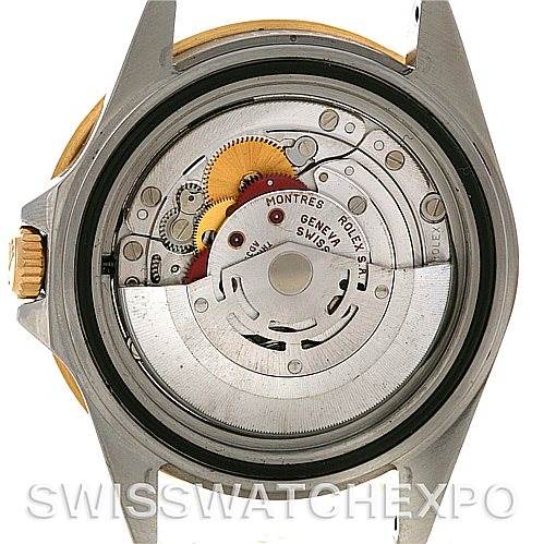 The image shows the open case back of a Rolex GMT-Master 16713 Men
s Stainless Steel Brown Dial 16713 Men
s Stainless Steel Brown Dial watch, revealing its internal movement mechanism.
