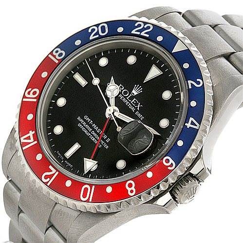 This image shows a Rolex GMT-Master 16710 Men's Stainless Steel Black Dial 16710 Men's Stainless Steel Black Dial watch face and bezel, angled slightly to the left, highlighting its blue and red bezel and stainless steel bracelet.