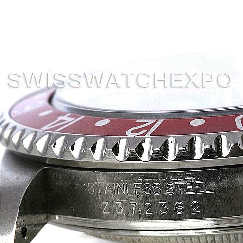 This close-up image shows the side angle of a Rolex GMT-Master 16710 Men's Stainless Steel Black Dial 16710 Men's Stainless Steel Black Dial with a focus on the bezel and serial number engraving.
