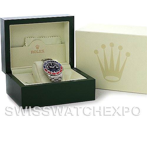 The image shows a Rolex GMT-Master 16710 Men's Stainless Steel Black Dial 16710 Men's Stainless Steel Black Dial watch in an open green display box, with a beige outer box beside it.
