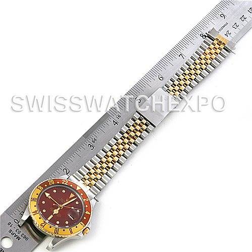 The image shows a Rolex GMT-Master 16753 Men's Stainless Steel Brown Dial 16753 Men's Stainless Steel Brown Dial watch laid flat alongside a ruler for measurement.