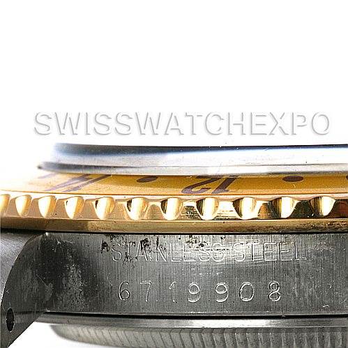 This image shows a side view close-up of the bezel and case of a Rolex GMT-Master 16753 Men's Stainless Steel Brown Dial 16753 Men's Stainless Steel Brown Dial model, highlighting the serial number and "stainless steel" engravings.