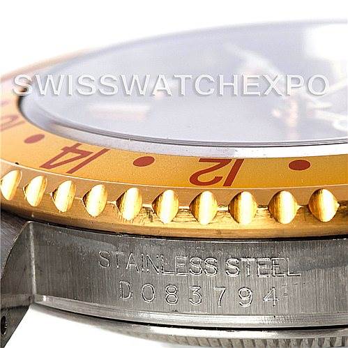 The image shows a close-up side view of a Rolex GMT-Master 16713 Men's Stainless Steel Brown Dial 16713 Men's Stainless Steel Brown Dial watch, highlighting its bezel, stainless steel case, and part of its serial number.