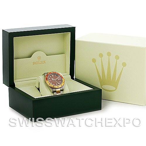 The image shows a Rolex GMT-Master 16713 Men's Stainless Steel Brown Dial 16713 Men's Stainless Steel Brown Dial watch placed inside an open green box, with an outer cream box beside it.