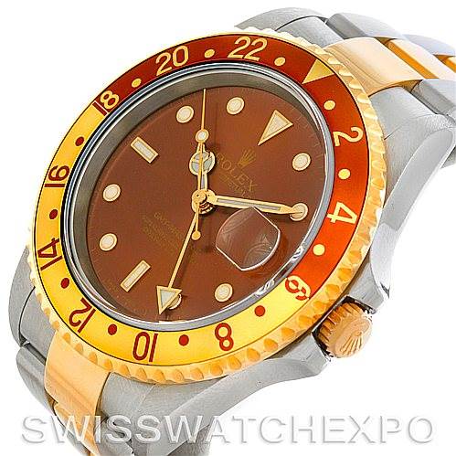 The image shows a close-up, angled view of a Rolex GMT-Master 16713 Men's Stainless Steel Brown Dial 16713 Men's Stainless Steel Brown Dial watch featuring its bezel, dial, and part of the bracelet.