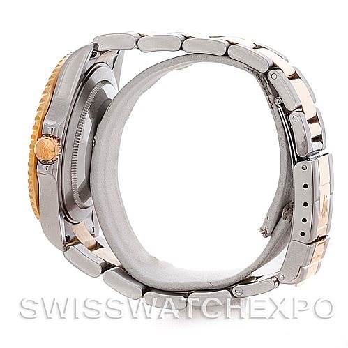 The image depicts a side view of a Rolex GMT-Master 16713 Men's Stainless Steel Brown Dial 16713 Men's Stainless Steel Brown Dial watch, showing its bracelet, crown, and a partially visible bezel.