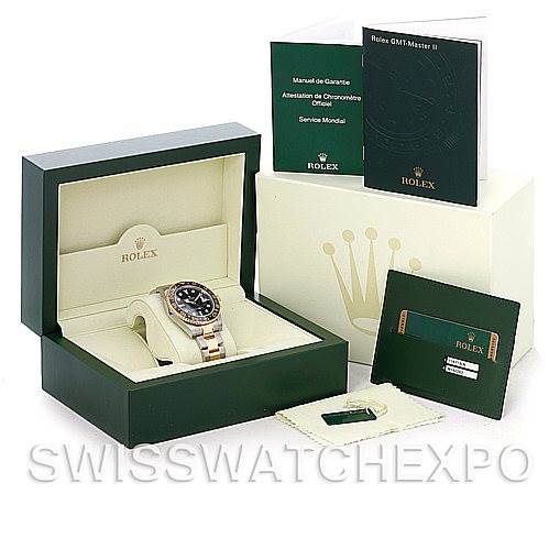 This image shows a Rolex GMT-Master 116713 Men's Stainless Steel Black Dial 116713 Men's Stainless Steel Black Dial watch in its box, accompanied by manuals, a warranty card, and additional packaging.