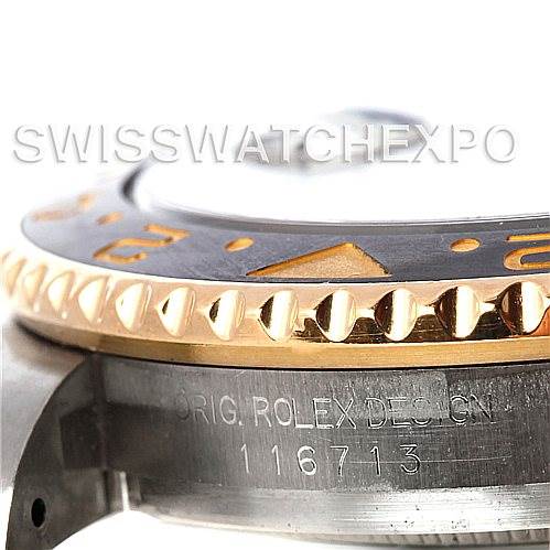 This close-up image of the Rolex GMT-Master 116713 Men's Stainless Steel Black Dial 116713 Men's Stainless Steel Black Dial watch shows the side angle of the bezel, with the model number 116713 engraved.
