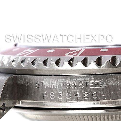 The image shows a close-up side angle of the Rolex GMT-Master 16710 Men's Stainless Steel Black Dial 16710 Men's Stainless Steel Black Dial's stainless steel case and partial bezel with serial number visible.