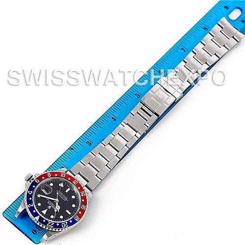 The image shows a top-down view of a Rolex GMT-Master 16710 Men's Stainless Steel Black Dial 16710 Men's Stainless Steel Black Dial watch, displaying the entire bracelet and bezel alongside a ruler for scale.