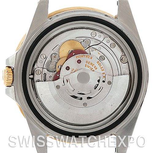 The image shows the back view of a Rolex GMT-Master 16713 Men's Stainless Steel Brown Dial 16713 Men's Stainless Steel Brown Dial watch, revealing its internal mechanical movement.