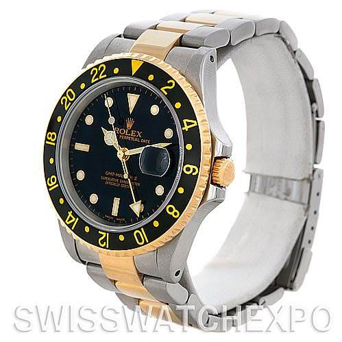 The image shows a Rolex GMT-Master 16713 Men's Stainless Steel Black Dial 16713 Men's Stainless Steel Black Dial watch at a side angle, highlighting its black and gold bezel, bracelet, and dial.