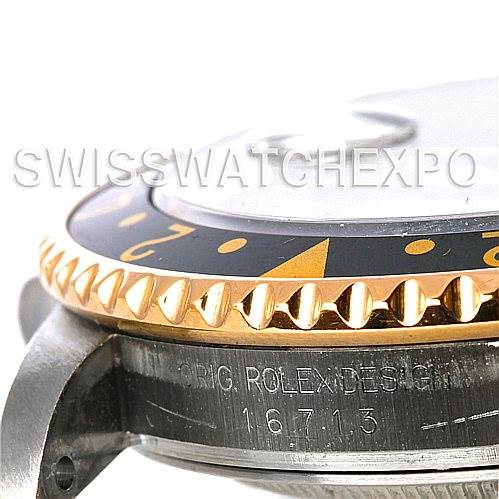 The image shows a close-up side view of the bezel, casing, and part of the dial of a Rolex GMT-Master 16713 Men's Stainless Steel Black Dial 16713 Men's Stainless Steel Black Dial model with the reference number 16713 engraved.