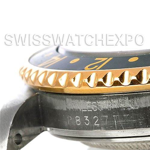 This image shows a close-up of the side profile of a Rolex GMT-Master 16713 Men's Stainless Steel Black Dial 16713 Men's Stainless Steel Black Dial watch, highlighting the bezel and part of the case with the serial number.
