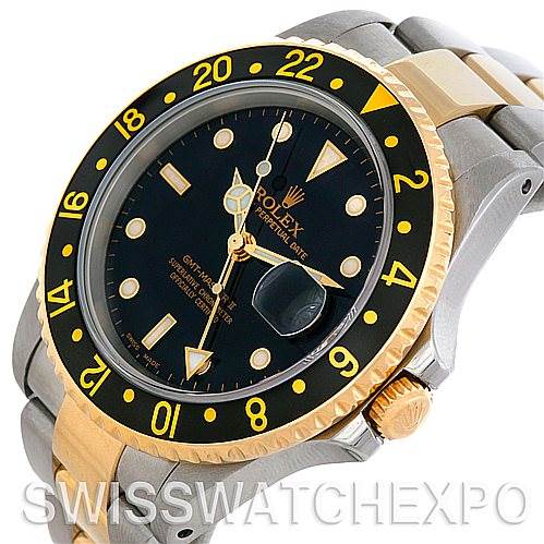 This image shows a close-up of the face and bezel of a Rolex GMT-Master 16713 Men's Stainless Steel Black Dial 16713 Men's Stainless Steel Black Dial watch, highlighting the dial, hands, and part of the bracelet.