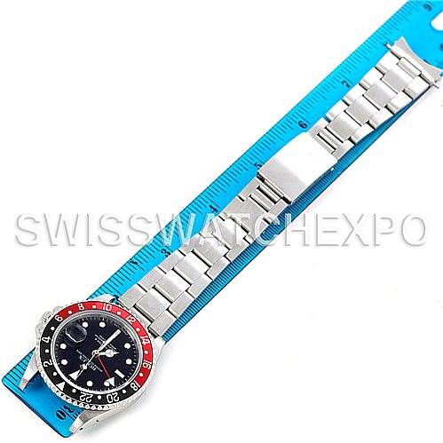 The image shows a Rolex GMT-Master 16710 Men's Stainless Steel Black Dial 16710 Men's Stainless Steel Black Dial watch laid flat on a blue ruler, displaying the full bracelet and bezel.