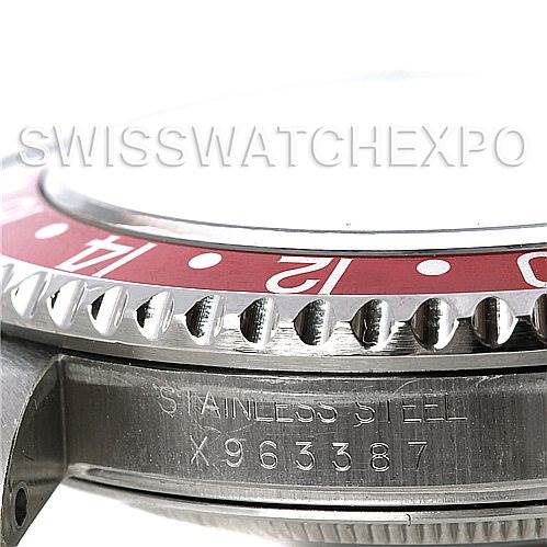 This image shows a side angle close-up of a Rolex GMT-Master 16710 Men's Stainless Steel Black Dial 16710 Men's Stainless Steel Black Dial watch's bezel and stainless steel case with an engraved serial number.