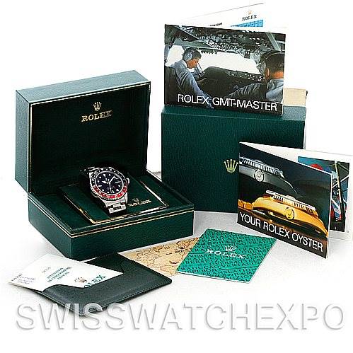 This image shows a Rolex GMT-Master 16710 Men's Stainless Steel Black Dial 16710 Men's Stainless Steel Black Dial watch in its box, accompanied by manuals, booklets, and a warranty cardholder, all photographed from a frontal angle.