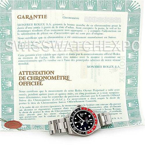 The image shows a Rolex GMT-Master 16710 Men's Stainless Steel Black Dial 16710 Men's Stainless Steel Black Dial watch with its metal bracelet, placed in front of the warranty and official chronometer certificate.