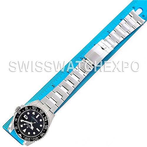 The image shows a top-down view of a Rolex GMT-Master 116710 Men's Stainless Steel Black Dial 116710 Men's Stainless Steel Black Dial watch, highlighting the entire band and face, with a ruler alongside for size reference.