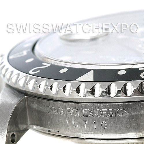 This image shows a close-up side view of a Rolex GMT-Master 16710 Men
s Stainless Steel Black Dial 16710 Men
s Stainless Steel Black Dial model 16710, focusing on the bezel, crystal, and case engraving.