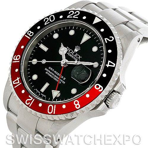The Rolex GMT-Master 16710 Men
s Stainless Steel Black Dial 16710 Men
s Stainless Steel Black Dial watch is shown at a slight angle, displaying its black and red bezel, dial, and crown, along with part of the bracelet.