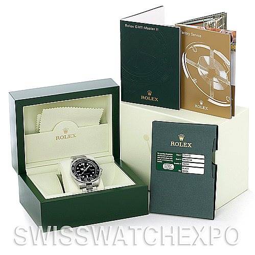The image shows a Rolex GMT-Master 116710 Men's Stainless Steel Black Dial 116710 Men's Stainless Steel Black Dial watch in its box, along with various booklets and a green Rolex card holder.